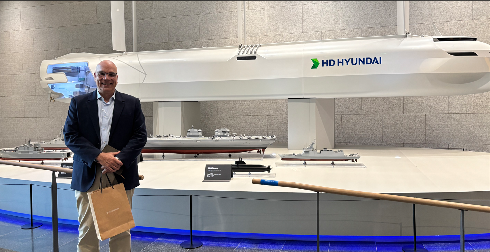 HD Hyundai shipbuilding vessel and submarine models on display